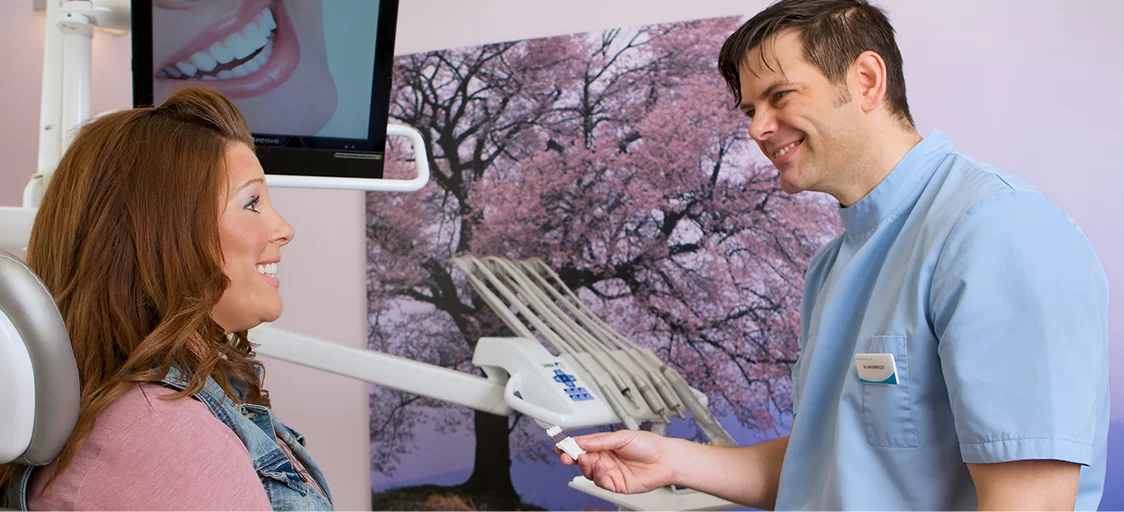 Staplehurst Dental Practice — dentist discussing treatment with a patient at Staplehurst