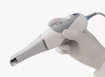 Dentist in Staplehurst holding the CS 3600 intraoral scanner