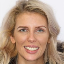 A portrait of a woman smiling after treatment at Staplehurst Dental Practice