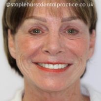 A photograph of a woman smiling
